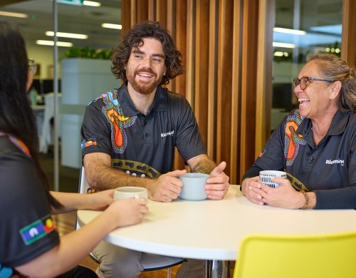 Three Richmind WA staff sitting around a table talking with cups of tea